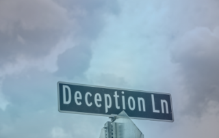 road sign for "Deception Ln."